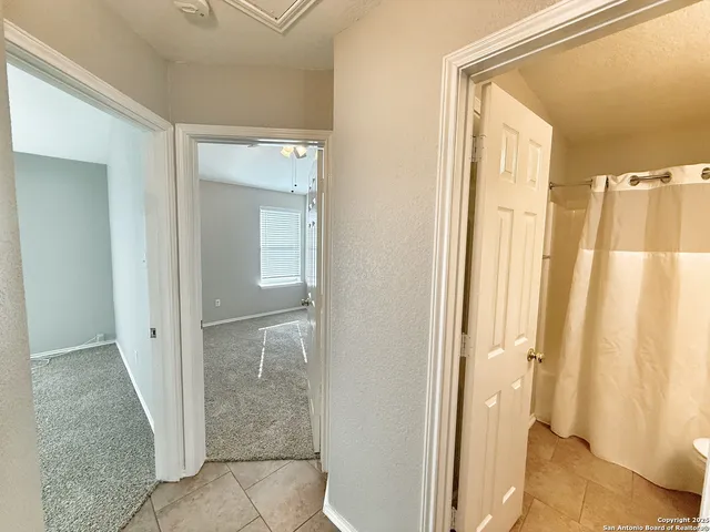 a view of bathroom with a shower and a sink