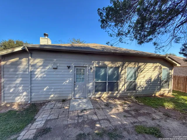 a backyard of a house with lots of green space