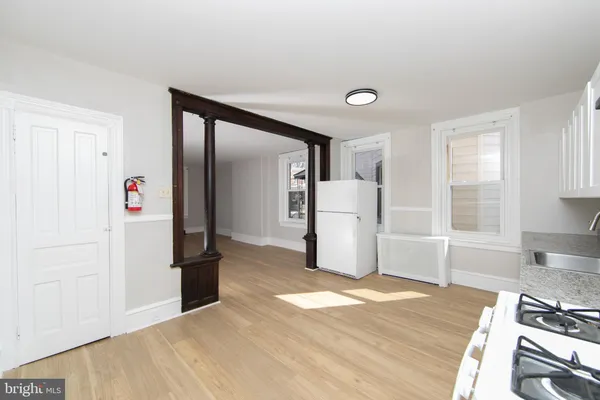a view of a kitchen with refrigerator and stove