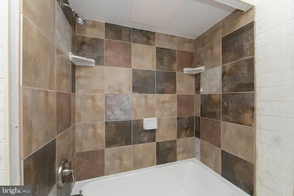 a bathroom with a sink toilet and mirror