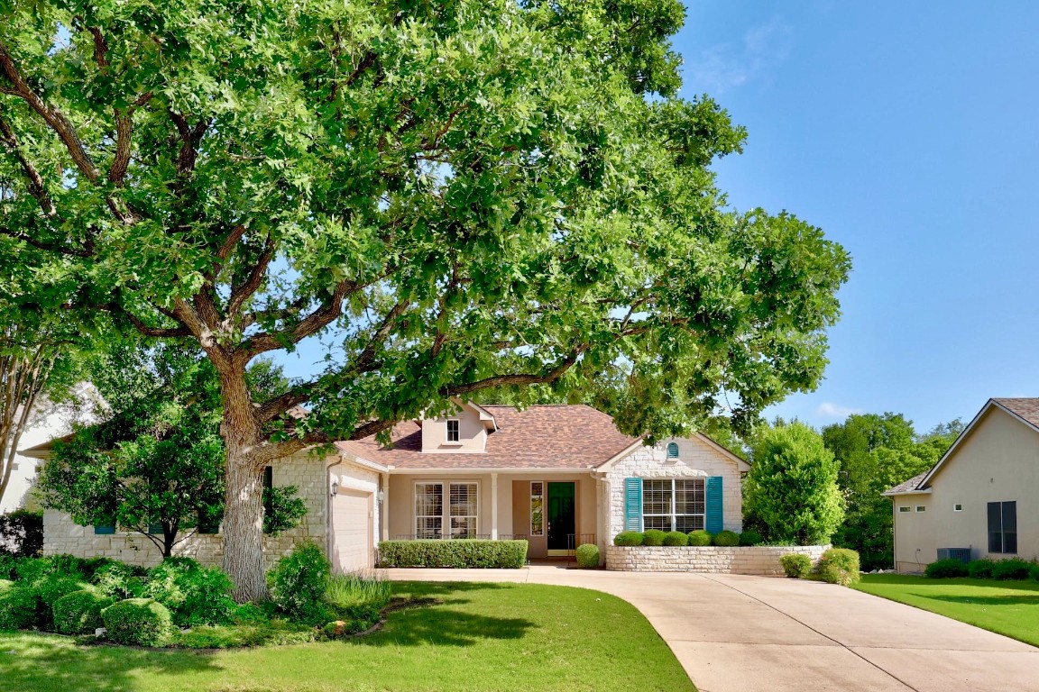 106 Winecup Way Georgetown, TX 78633 - Photo 1 of 1 a front view of a house with a garden