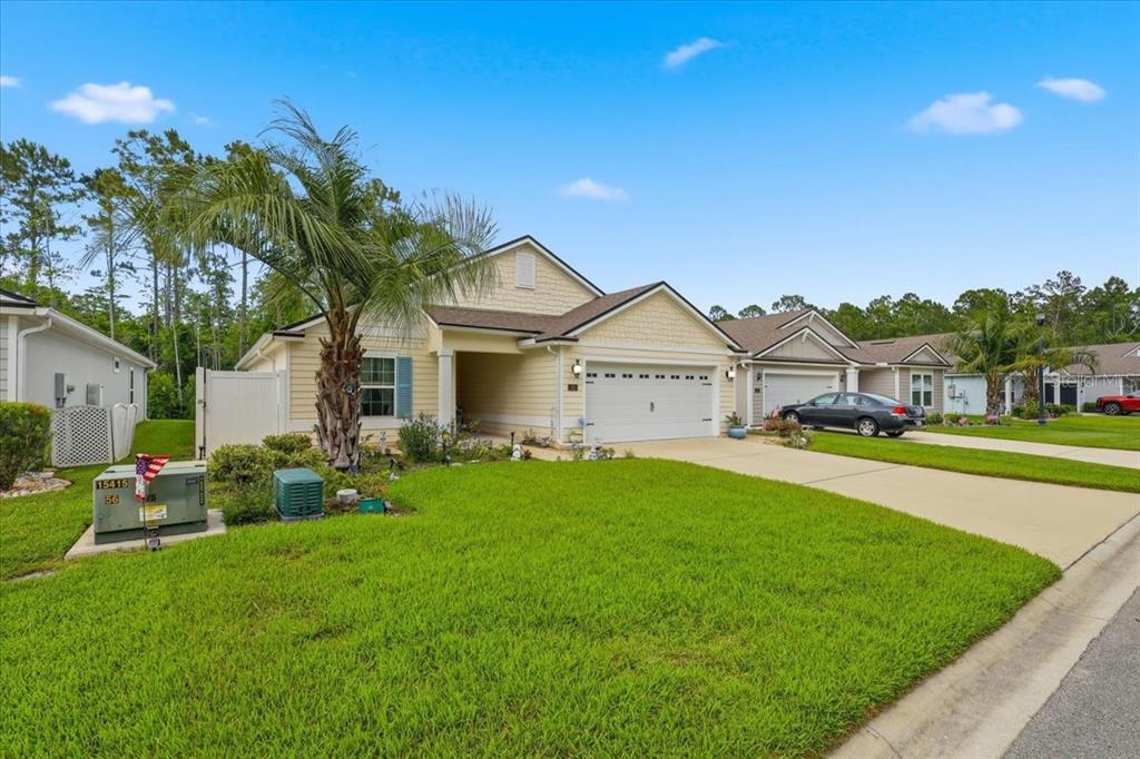 35 Birdie Way Bunnell, FL 32110 - Photo 45 of 57 a front view of house with yard and green space