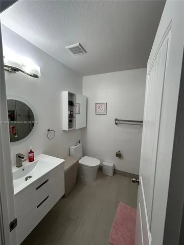 a view of a couches and a table in the patio