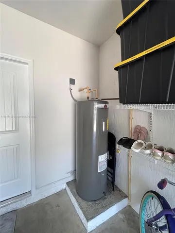 a kitchen with a sink a stove and chairs