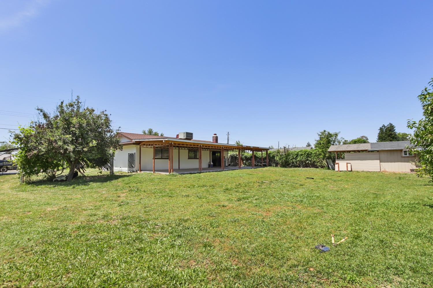 7208 7th Street Rio Linda, CA 95673 - Photo 32 of 41 a big house with a big yard and large trees
