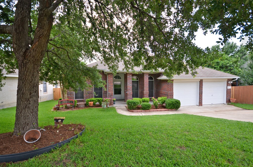 3607 Hawk Ridge Street Round Rock, TX 78665 - Photo 1 of 1 front view of a house with a yard