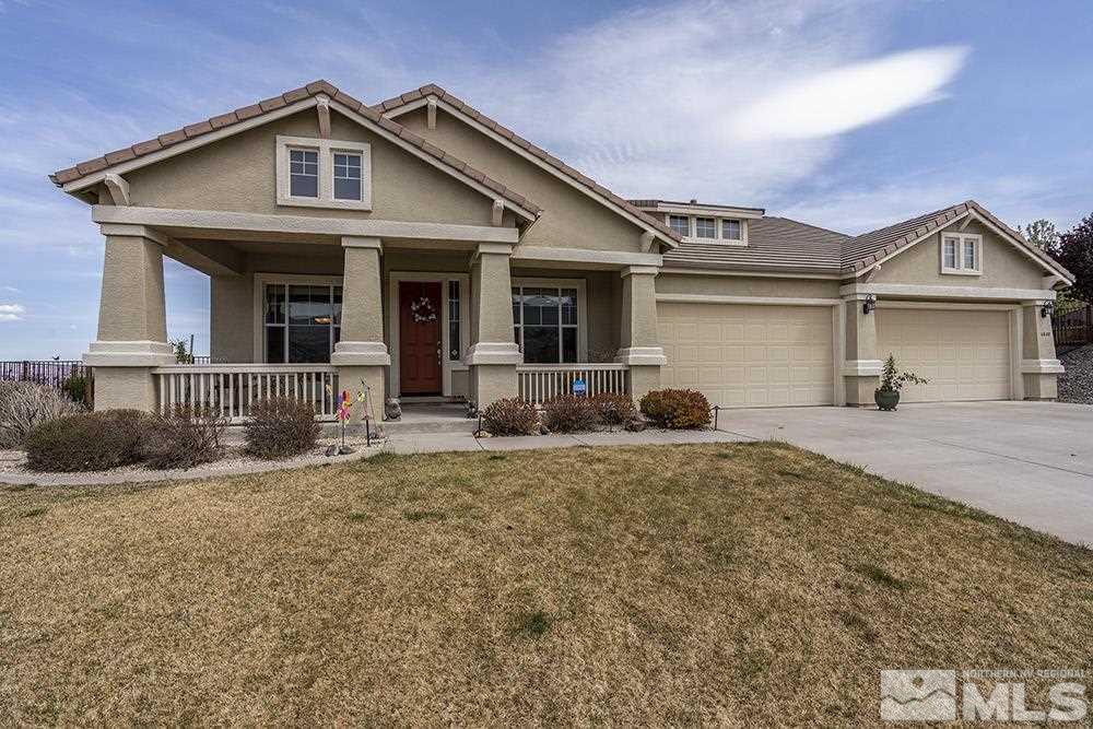 6840 Marble Canyon Road Reno, NV 89511 - Photo 1 of 39 a front view of a house with a yard