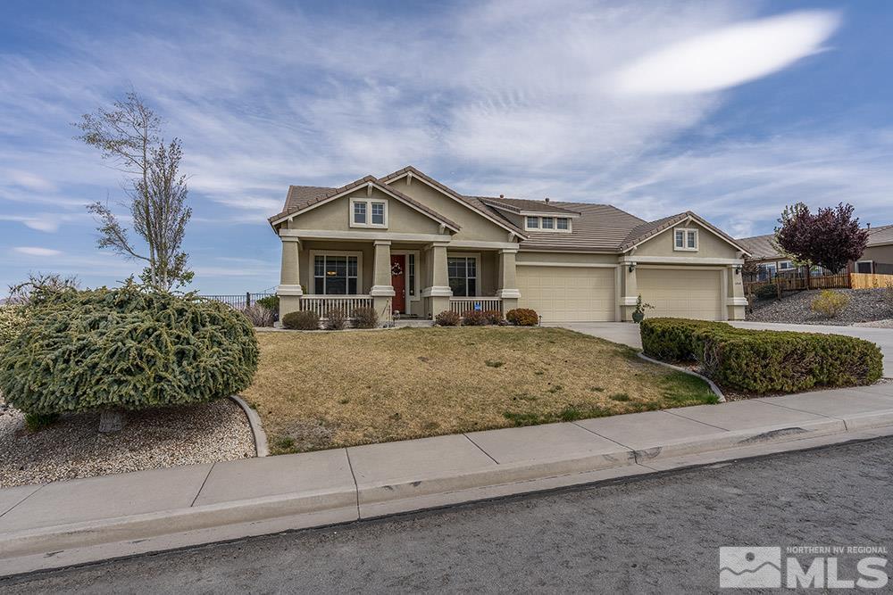 6840 Marble Canyon Road Reno, NV 89511 - Photo 27 of 39 a front view of a house with a yard and garage