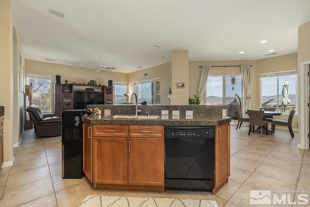6840 Marble Canyon Road Reno, NV 89511 - Photo 9 of 39 a kitchen with a sink and cabinets