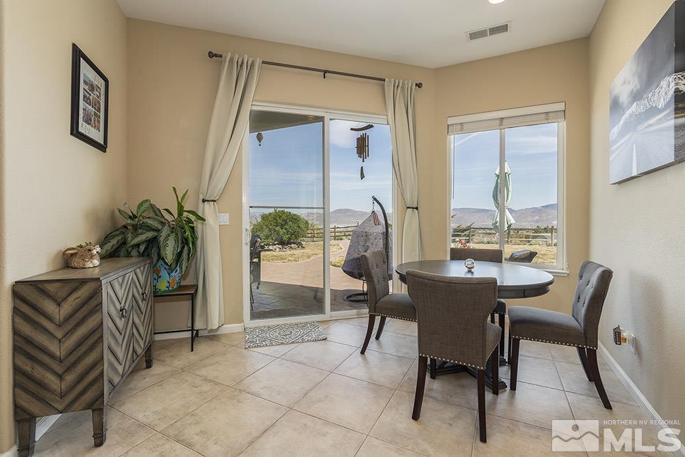 6840 Marble Canyon Road Reno, NV 89511 - Photo 10 of 39 a view of a dining room with furniture window and outside view