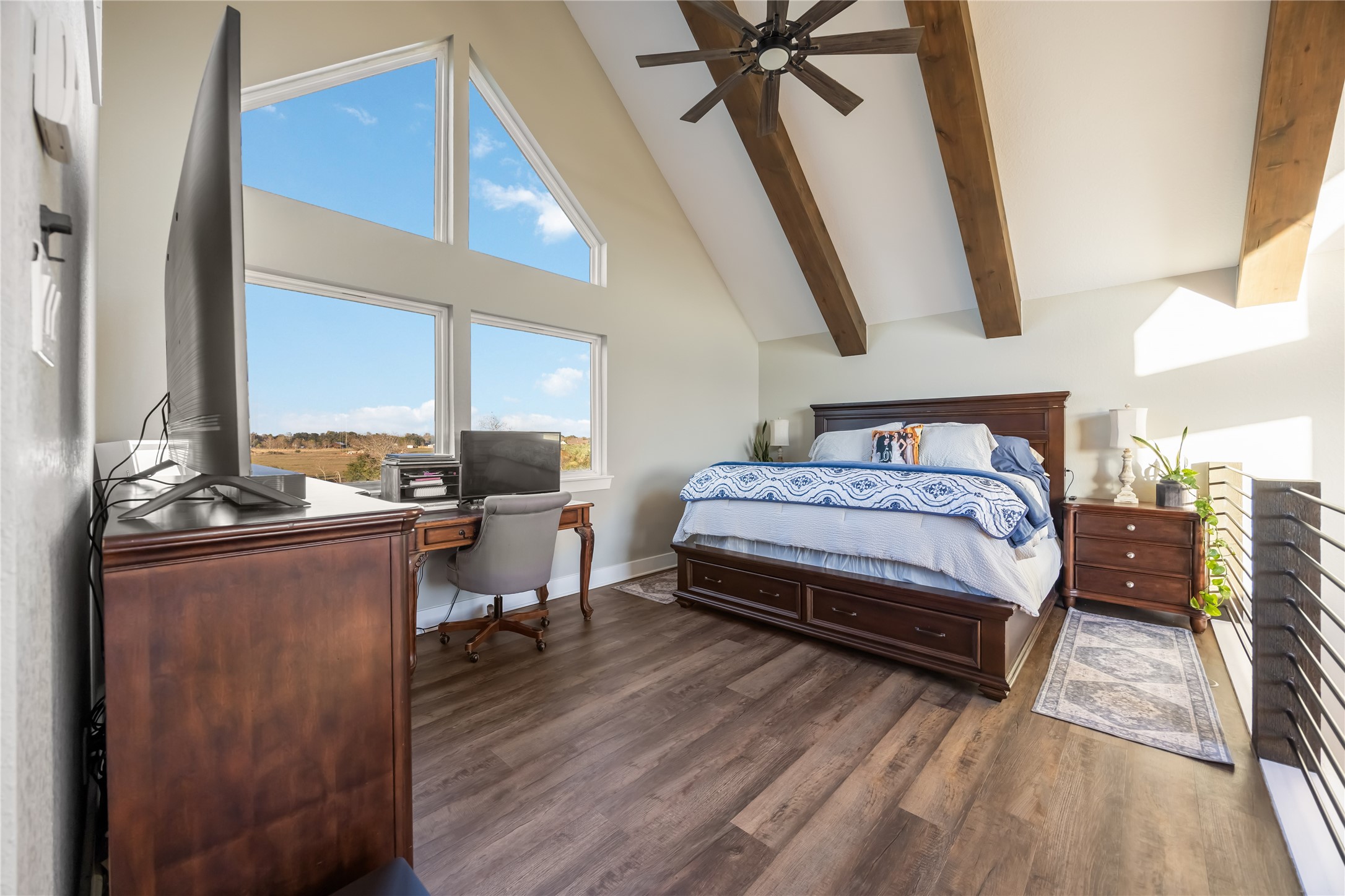 330 Ridge Road Manvel, TX 77578 - Photo 12 of 37 The bedroom is a loft, located upstairs with vaulted ceiling and a large picture window. The morning views will take your breath away.