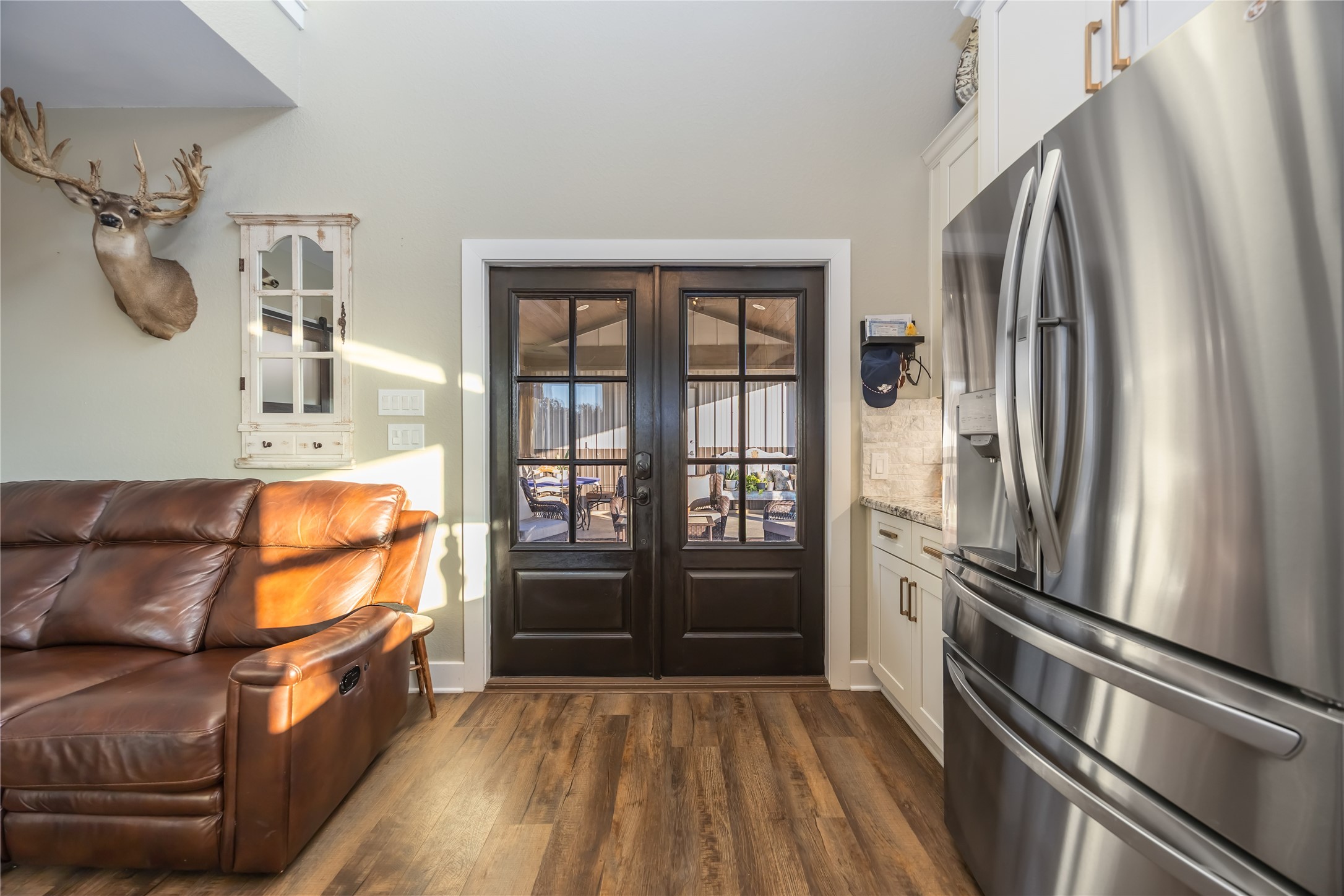 330 Ridge Road Manvel, TX 77578 - Photo 16 of 37 The entry way opens to the covered patio. It connects the Barn to the house.