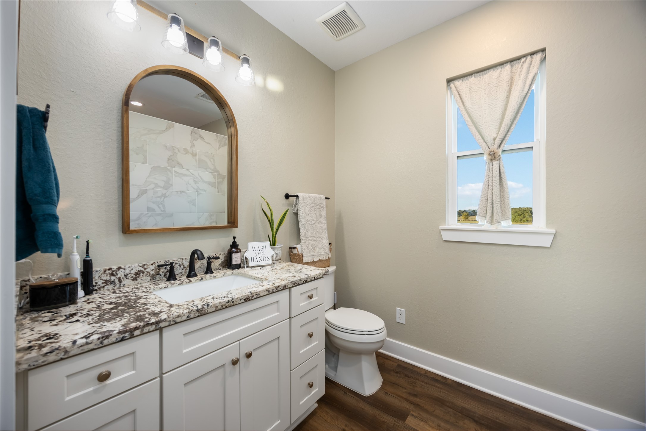 330 Ridge Road Manvel, TX 77578 - Photo 19 of 37 The bathroom offers a large vanity with drawers for storage.