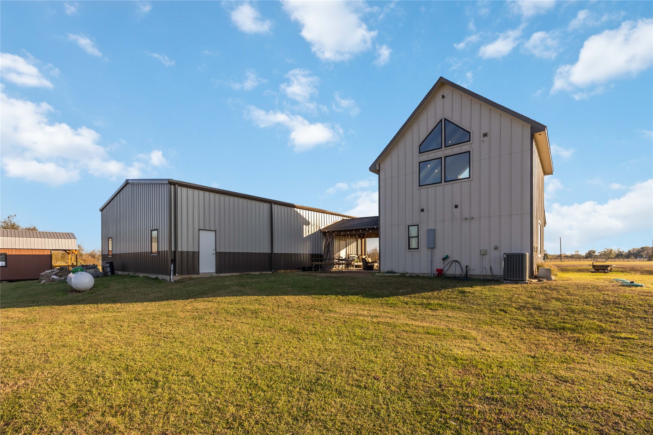 330 Ridge Road Manvel, TX 77578 - Photo 27 of 37 A view of the back of the house and barn.