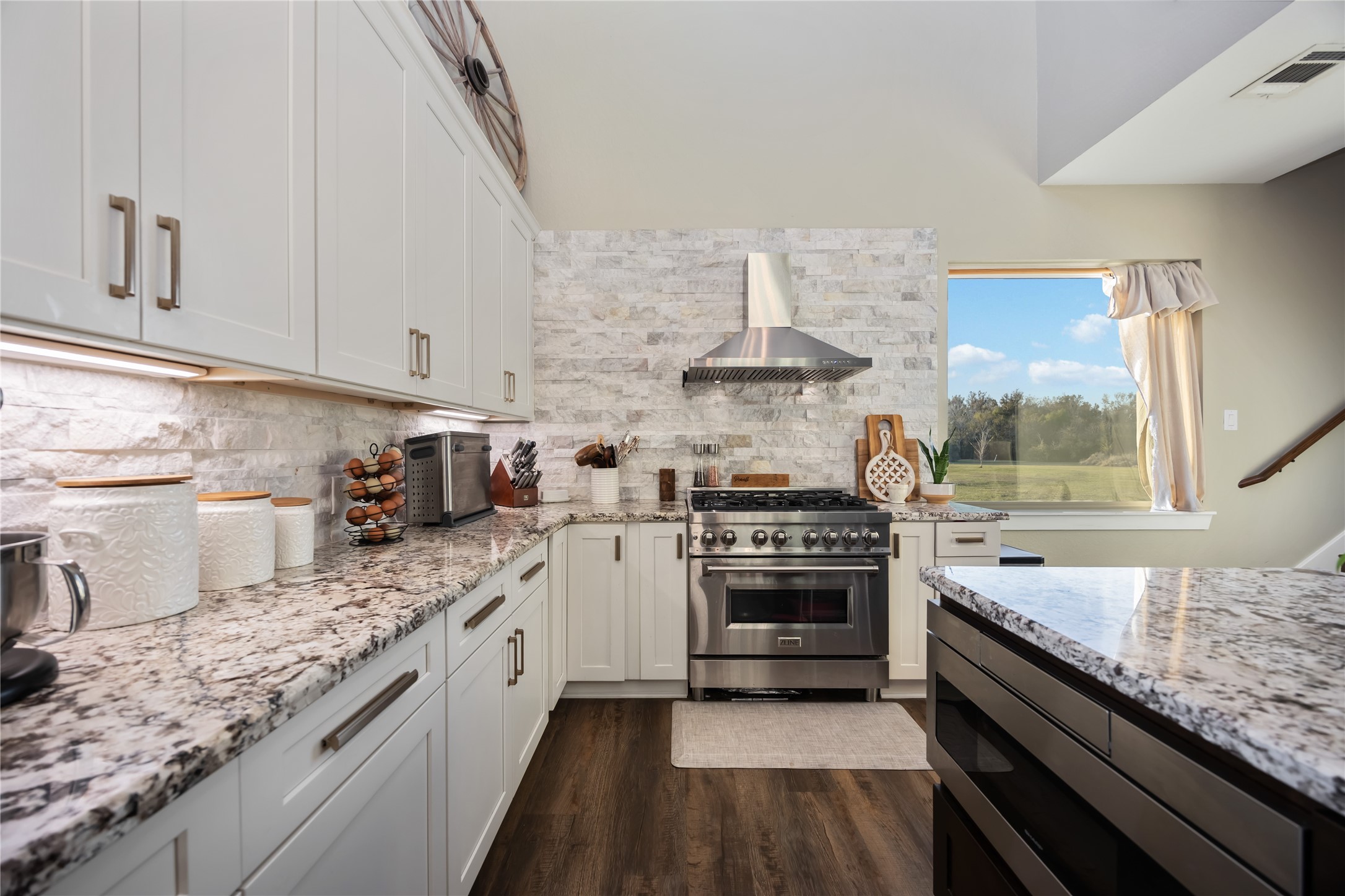 330 Ridge Road Manvel, TX 77578 - Photo 9 of 37 The kitchen offers a large stove, granite counter tops and an oversized island.