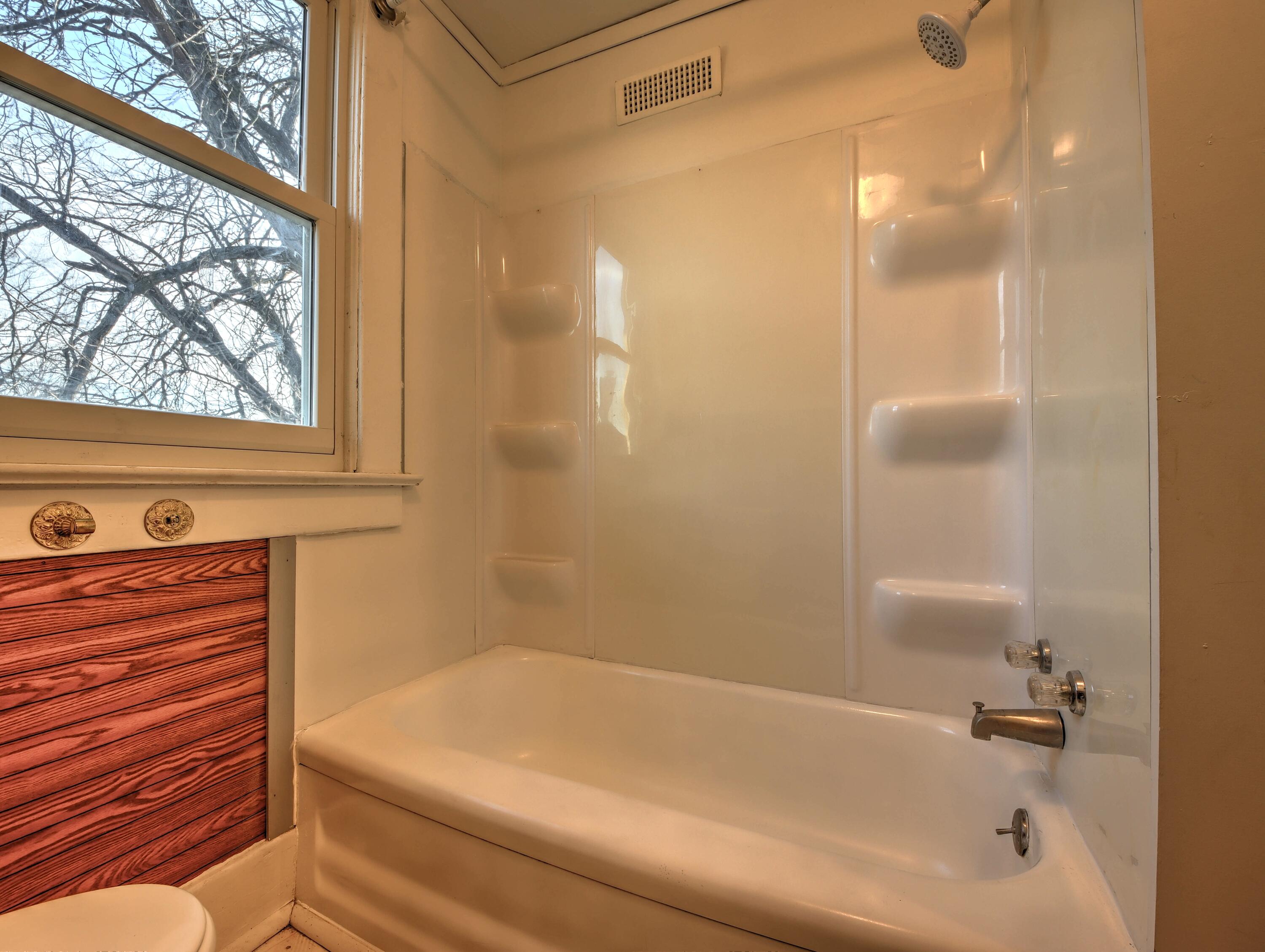 119 Patton Street La Porte, IN 46350 - Photo 20 of 26 a bathroom with a bathtub and shower