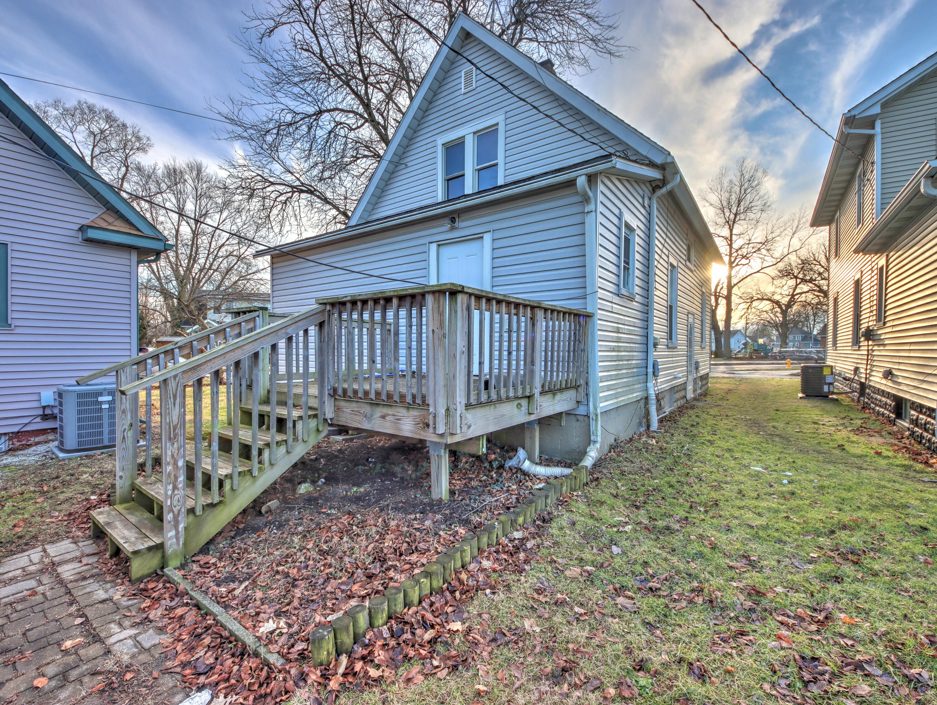 119 Patton Street La Porte, IN 46350 - Photo 25 of 26 a view of a house with a yard and wooden deck
