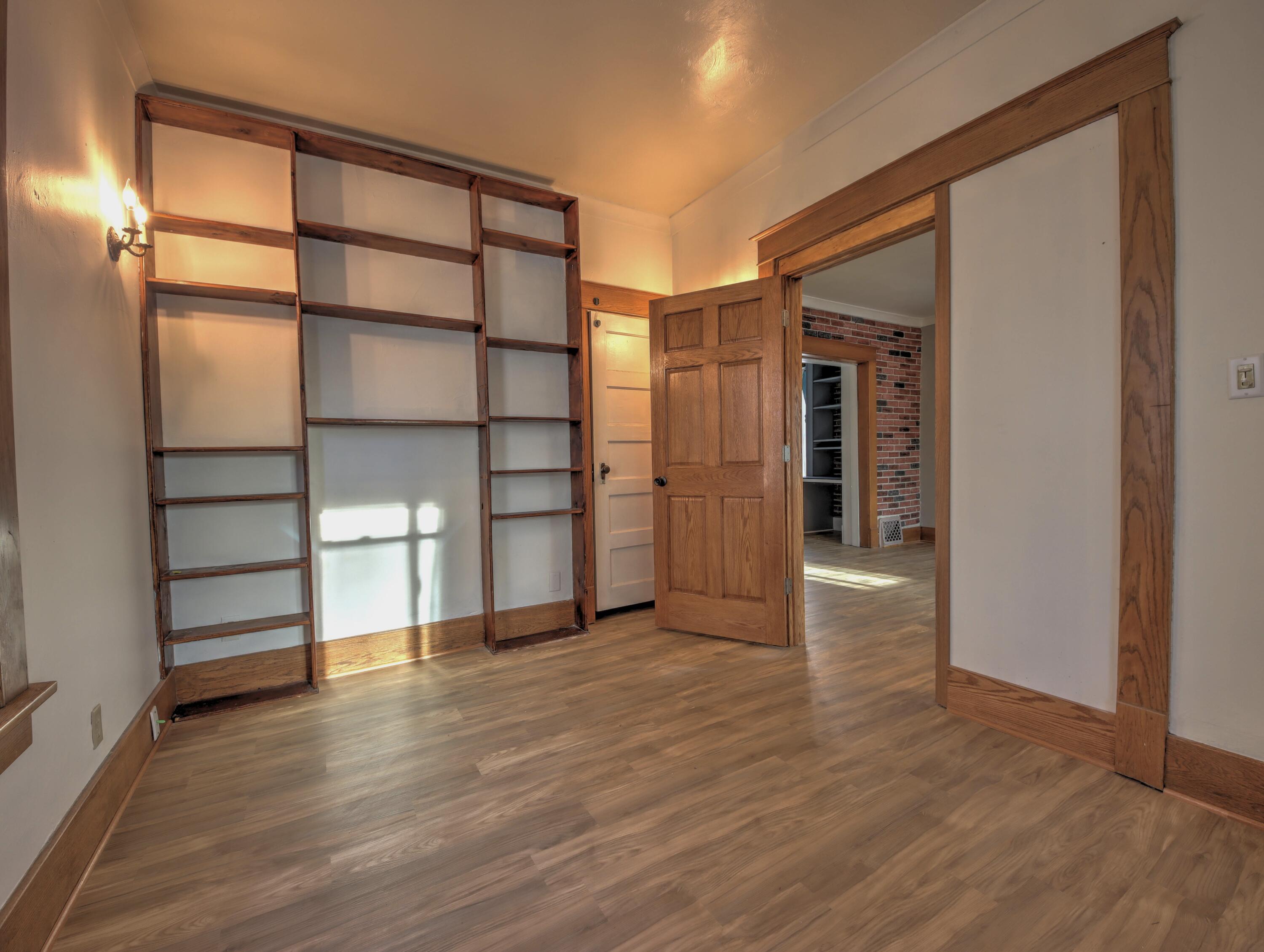 119 Patton Street La Porte, IN 46350 - Photo 5 of 26 an empty room with wooden floor and closet