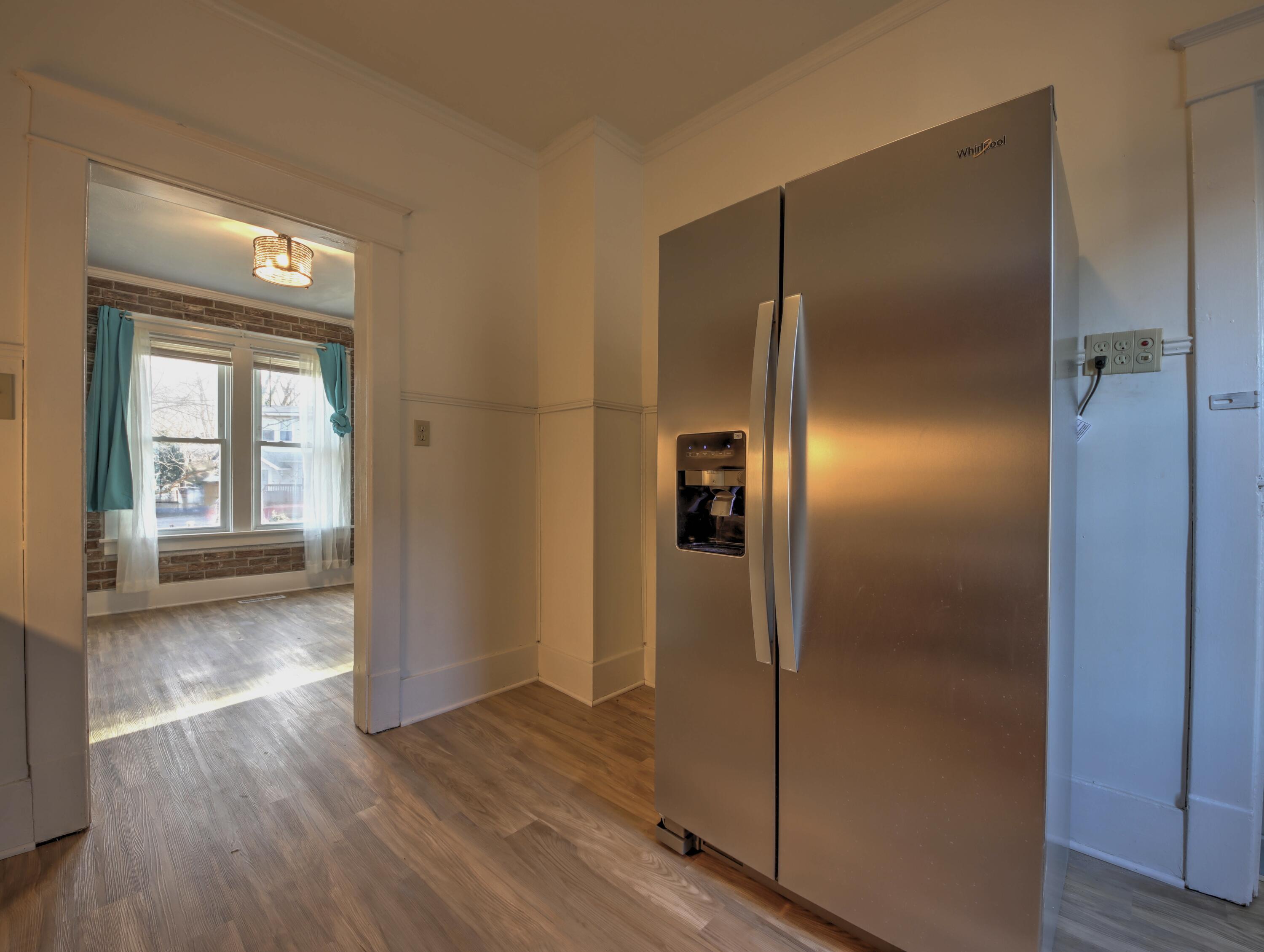 119 Patton Street La Porte, IN 46350 - Photo 9 of 26 a view of a hallway with wooden floor
