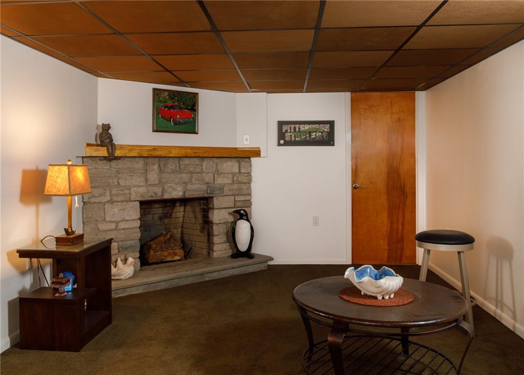 9415 Pannier Road Pittsburgh, PA 15237 - Photo 15 of 25 Den with stone fireplace