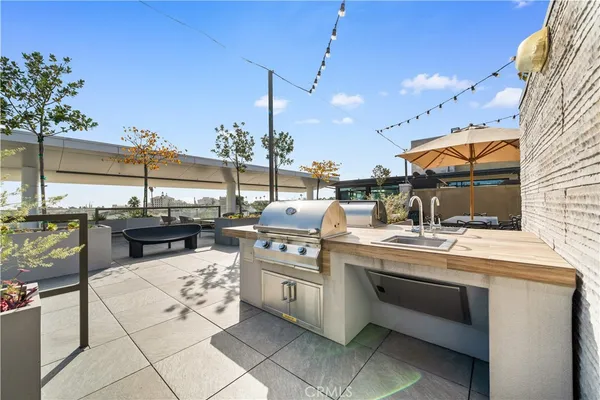 a kitchen with stainless steel appliances kitchen island granite countertop a sink and cabinets