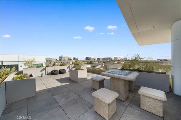 a view of a terrace with furniture and stove