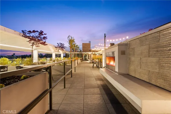 a swimming pool with outdoor seating