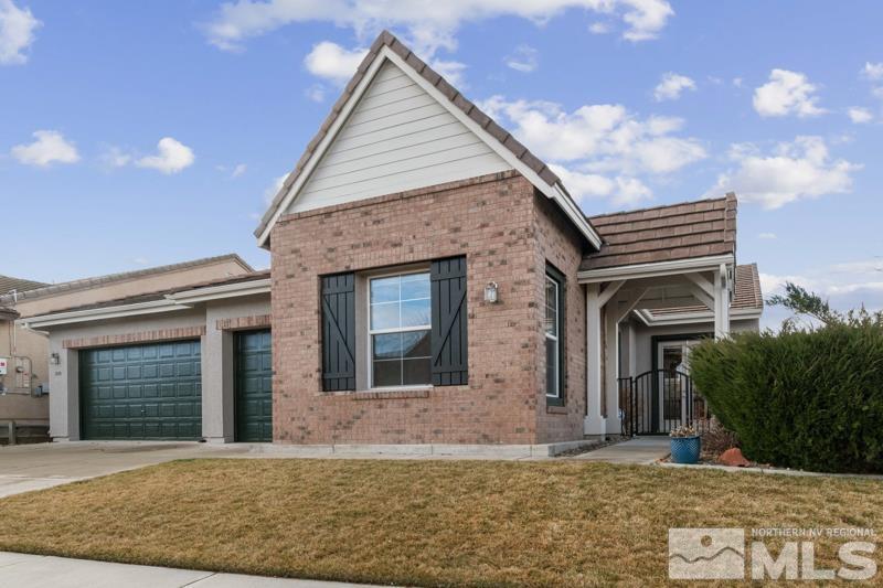 1630 Brightstone Court Reno, NV 89521 - Photo 1 of 27 a front view of a house with a garden