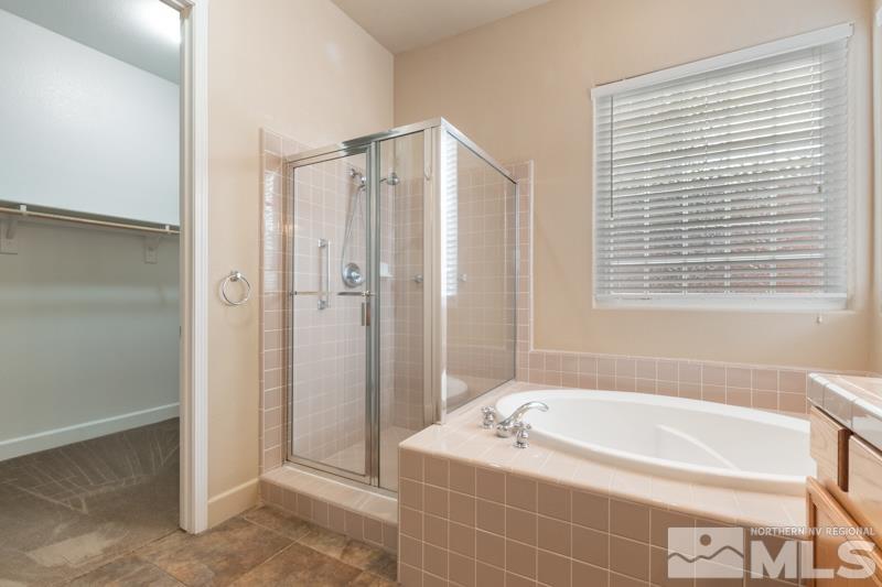 1630 Brightstone Court Reno, NV 89521 - Photo 15 of 27 a spacious bathroom with a bathtub and a shower