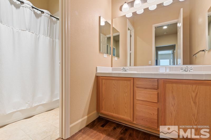 1630 Brightstone Court Reno, NV 89521 - Photo 20 of 27 a bathroom with a sink and a mirror