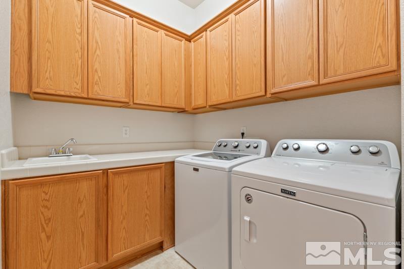 1630 Brightstone Court Reno, NV 89521 - Photo 24 of 27 a utility room with dryer and washer