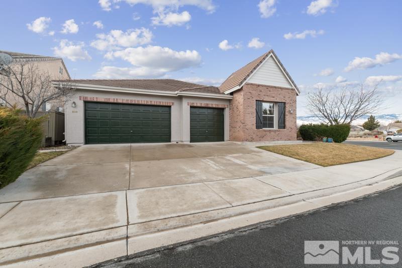 1630 Brightstone Court Reno, NV 89521 - Photo 6 of 27 a front view of a house with a garage