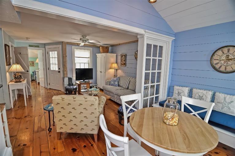 7 Hyannis Point Road, Unit 771HY Mashpee, MA 02649 - Photo 3 of 14 a living room with furniture a wooden floor and next to a window