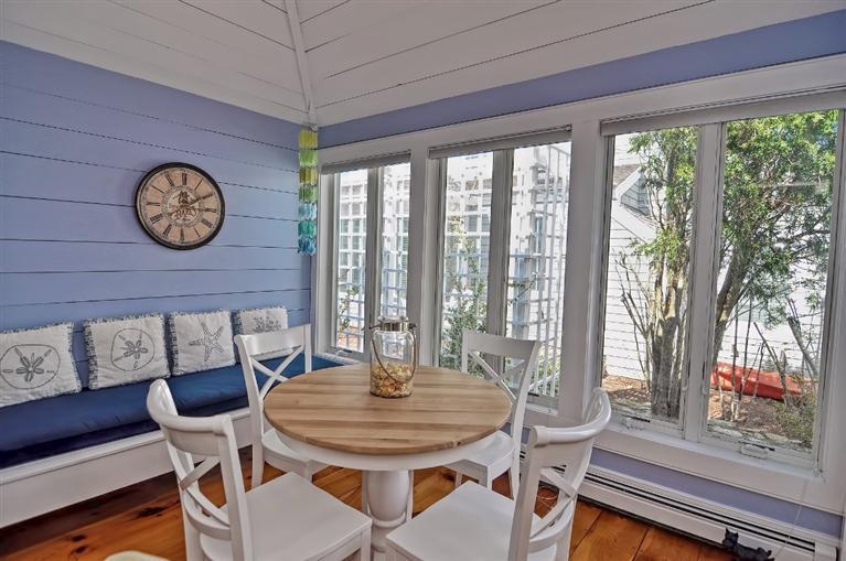7 Hyannis Point Road, Unit 771HY Mashpee, MA 02649 - Photo 8 of 14 a view of a dining room with furniture wooden floor and a large window