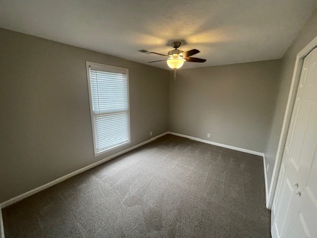 905 Lenora Court Nashville, TN 37217 - Photo 14 of 21 an empty room with a chandelier fan and windows