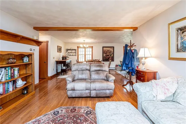 a living room with furniture and a book shelf