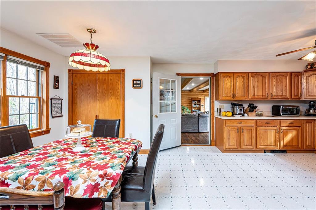 120 Youngstown Ridge Road Ligonier, PA 15658 - Photo 13 of 50 a bed room with a bed and a chandelier