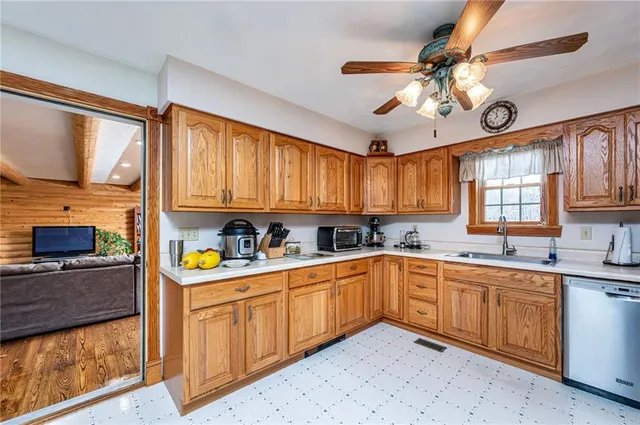 a kitchen with cabinets a sink and appliances