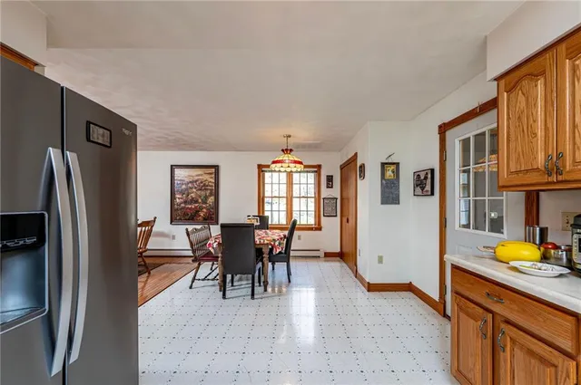 a view of a dining room with furniture window and outside view