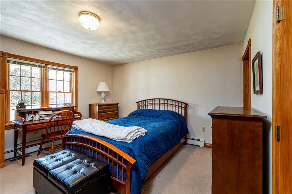 120 Youngstown Ridge Road Ligonier, PA 15658 - Photo 25 of 50 a bedroom with a bed and a window