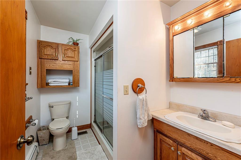 120 Youngstown Ridge Road Ligonier, PA 15658 - Photo 27 of 50 a bathroom with a toilet sink and mirror
