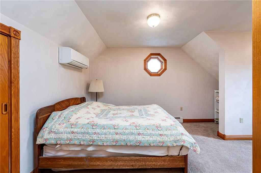 120 Youngstown Ridge Road Ligonier, PA 15658 - Photo 30 of 50 a bedroom with a bed and a window