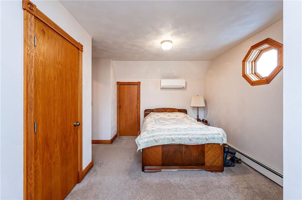 120 Youngstown Ridge Road Ligonier, PA 15658 - Photo 31 of 50 a bedroom with a bed and a window