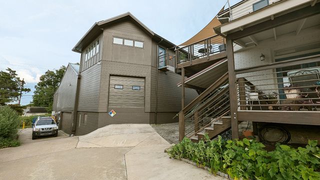 an aerial view of houses with yard
