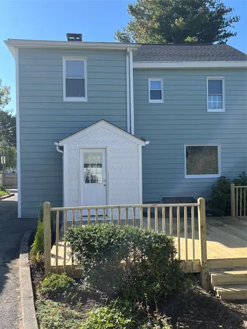 a brick building with a bench in front of it