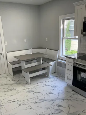 a view of a livingroom with furniture and a fireplace