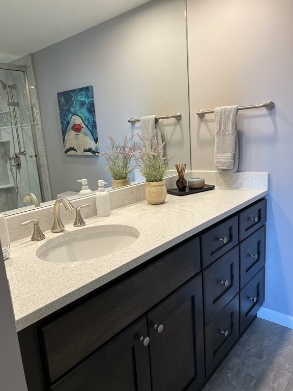 9 West Broadway, Unit 500 Boston, MA 02127 - Photo 16 of 21 a bathroom with a sink and a mirror