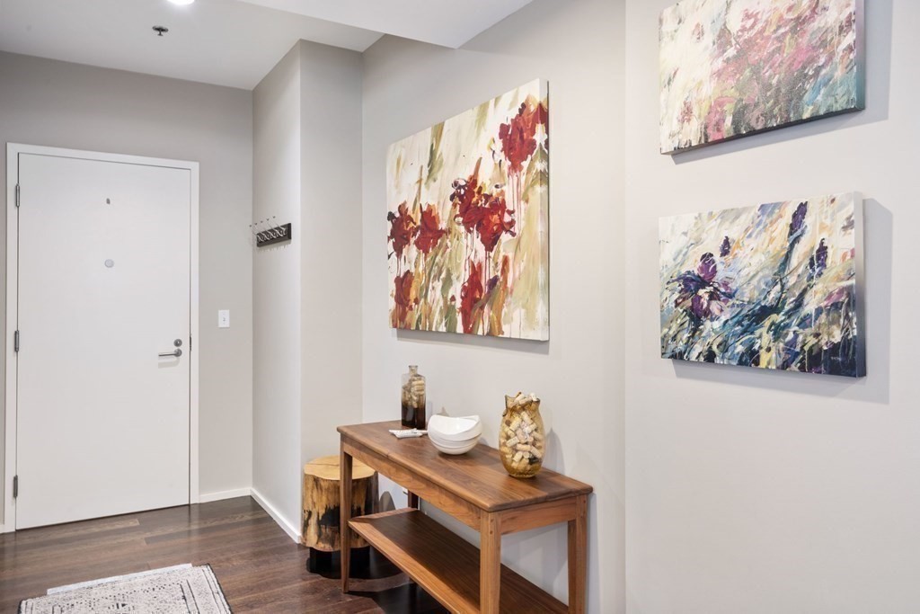9 West Broadway, Unit 500 Boston, MA 02127 - Photo 19 of 21 a view of a workspace with furniture and wooden floor