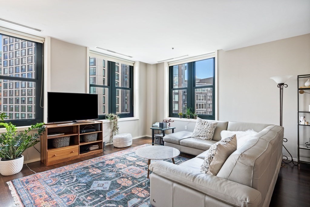 9 West Broadway, Unit 500 Boston, MA 02127 - Photo 3 of 21 a living room with furniture and a flat screen tv
