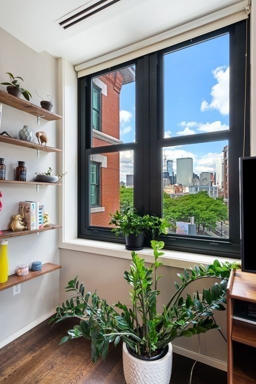 9 West Broadway, Unit 500 Boston, MA 02127 - Photo 7 of 21 a view of a dining room with furniture window and wooden floor